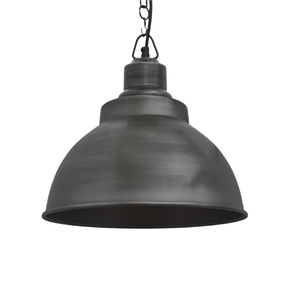 Industrial-style pendant light with a brushed pewter exterior, hanging from a black cord.