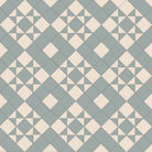 Victorian-style tile pattern with pale green star motifs on an ivory-white background in a geometric grid.  