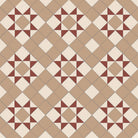 Victorian-style tile pattern featuring terracotta-red star motifs with white accents on a linen background in a geometric grid.   