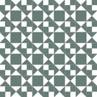 Victorian-style black and white tile pattern featuring interlocking triangles, squares, and diamond shapes in a symmetrical geometric design.  