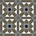 Victorian-style geometric tile pattern featuring interlocking squares and triangles in anthracite, shades of grey and blue, with dramatic super-white and black accents that form repeating star motifs within a tessellated layout. 