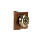 Switch to Wood's Dolly Light Switch Smooth Dome - 1 Gang Square Backplate Antique Brass in Medium Oak 