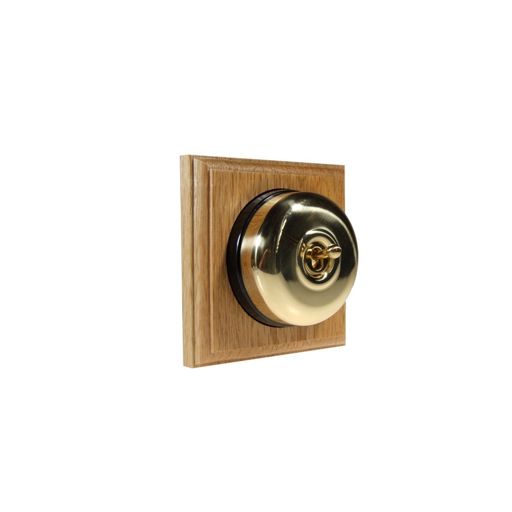 Switch to Wood's Dolly Light Switch Smooth Dome - 1 Gang Square Backplate Polished Brass in Light Oak
