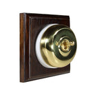 Switch to Wood's Dolly Light Switch Smooth Dome - 1 Gang Square Backplate Polished Brass in Dark Oak