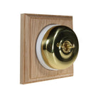 Switch to Wood's Dolly Light Switch Smooth Dome - 1 Gang Square Backplate Polished Brass in Unfinished Oak