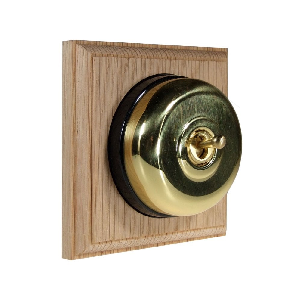 Switch to Wood's Dolly Light Switch Smooth Dome - 1 Gang Square Backplate Polished Brass in Unfinished Oak