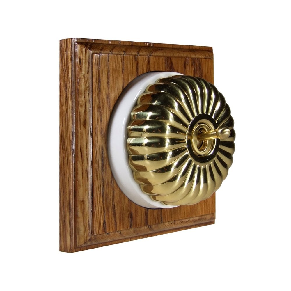 Switch to Wood's Dolly Light Switch Fluted Dome - 1 Gang Square Backplate Polished Brass in Medium Oak 