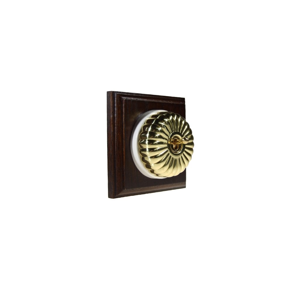 Switch to Wood's Dolly Light Switch Fluted Dome - 1 Gang Square Backplate Polished Brass in Dark Oak