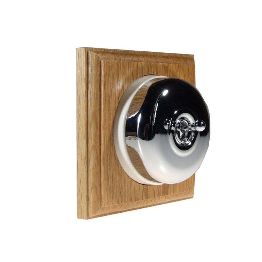 Switch to Wood's Dolly Light Switch Smooth Dome - 1 Gang Square Backplate Polished Chrome in Light Oak