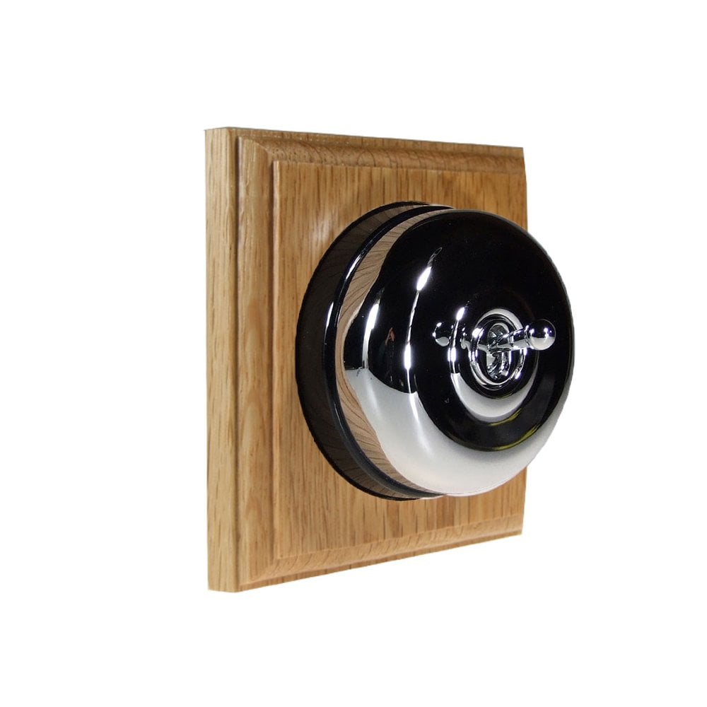 Switch to Wood's Dolly Light Switch Smooth Dome - 1 Gang Square Backplate Polished Chrome in Light Oak