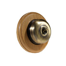 Switch to Wood's Dolly Light Switch Smooth Dome - 1 Gang Round Backplate Antique Brass in Light Oak