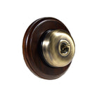 Switch to Wood's Dolly Light Switch Smooth Dome - 1 Gang Round Backplate Antique Brass in Dark Oak