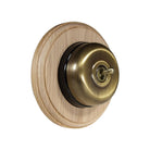 Switch to Wood's Dolly Light Switch Smooth Dome - 1 Gang Round Backplate Antique Brass in Unfinished Oak