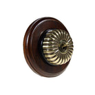 Switch to Wood's Dolly Light Switch Fluted Dome - 1 Gang Round Backplate Antique Brass in Dark Oak