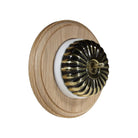 Switch to Wood's Dolly Light Switch Fluted Dome - 1 Gang Round Backplate Antique Brass in Unfinished Oak