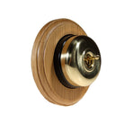 Switch to Wood's Dolly Light Switch Smooth Dome - 1 Gang Round Backplate Polished Brass in Light Oak