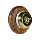 Switch to Wood's Dolly Light Switch Smooth Dome - 1 Gang Round Backplate Polished Brass in Medium Oak 