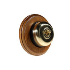 Switch to Wood's Dolly Light Switch Smooth Dome - 1 Gang Round Backplate Polished Brass in Medium Oak 