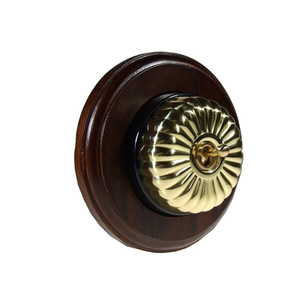 Switch to Wood's Dolly Light Switch Fluted Dome - 1 Gang Round Backplate Polished Brass in Dark Oak