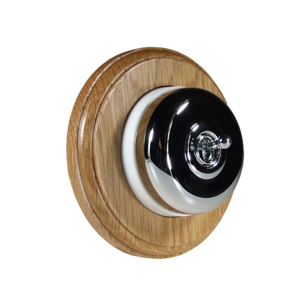 Switch to Wood's Dolly Light Switch Smooth Dome - 1 Gang Round Backplate Polished Chrome in Light Oak
