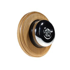 Switch to Wood's Dolly Light Switch Smooth Dome - 1 Gang Round Backplate Polished Chrome in Light Oak
