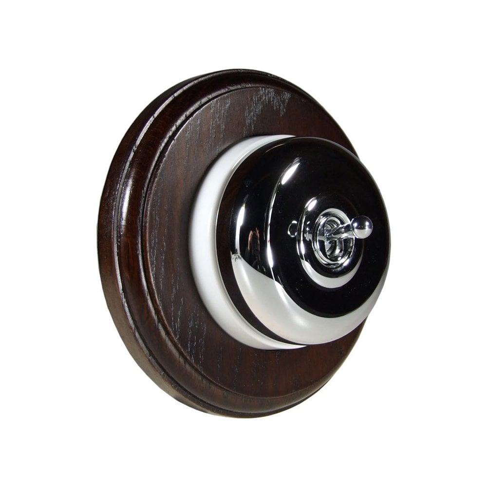 Switch to Wood's Dolly Light Switch Smooth Dome - 1 Gang Round Backplate Polished Chrome in Dark Oak