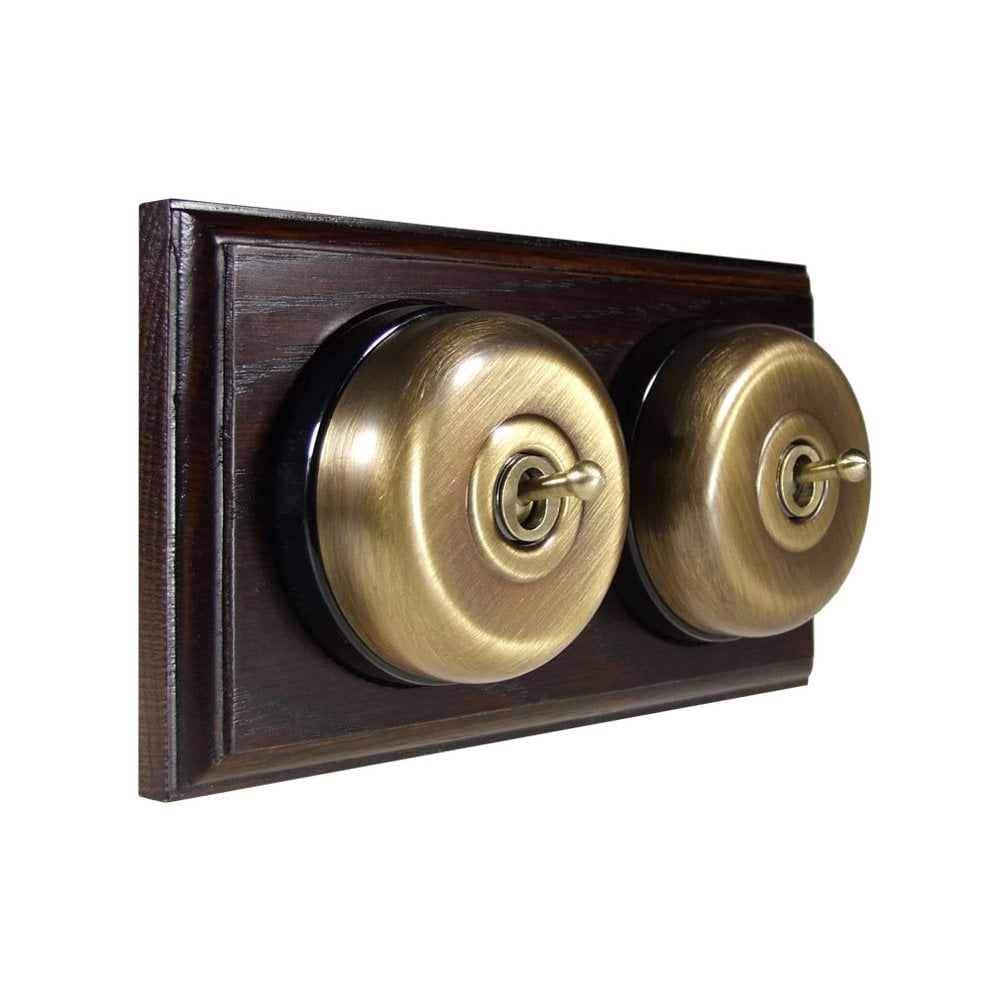 Switch to Wood's Dolly Light Switch Smooth Dome - 2 Gang Horizontal Antique Brass in Dark Oak
