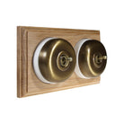 Switch to Wood's Dolly Light Switch Smooth Dome - 2 Gang Horizontal Antique Brass in Unfinished Oak