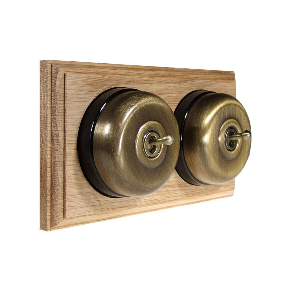 Switch to Wood's Dolly Light Switch Smooth Dome - 2 Gang Horizontal Antique Brass in Unfinished Oak