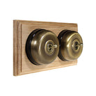 Switch to Wood's Dolly Light Switch Smooth Dome - 2 Gang Horizontal Antique Brass in Unfinished Oak