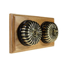 Switch to Wood's Dolly Light Switch Fluted Dome - 2 Gang Horizontal Antique Brass in Light Oak