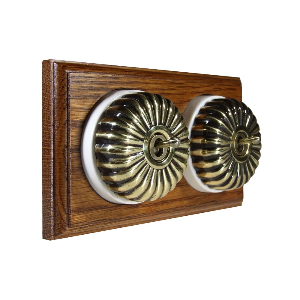 Switch to Wood's Dolly Light Switch Fluted Dome - 2 Gang Horizontal Antique Brass in Medium Oak 
