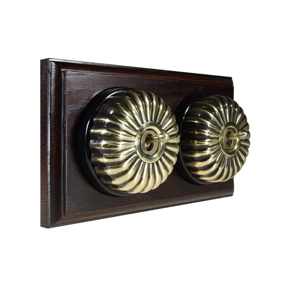 Switch to Wood's Dolly Light Switch Fluted Dome - 2 Gang Horizontal Antique Brass in Dark Oak
