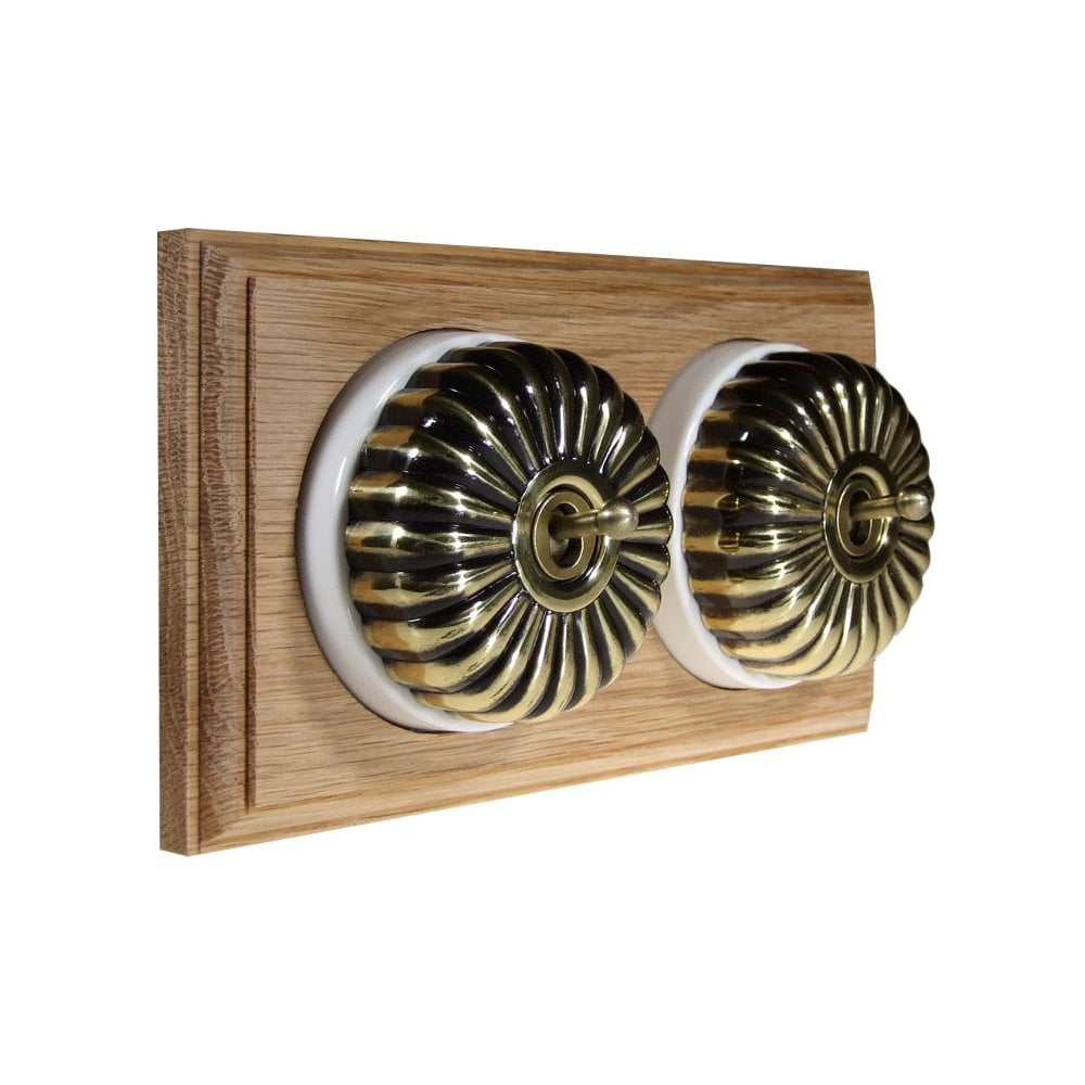 Switch to Wood's Dolly Light Switch Fluted Dome - 2 Gang Horizontal Antique Brass in Unfinished Oak