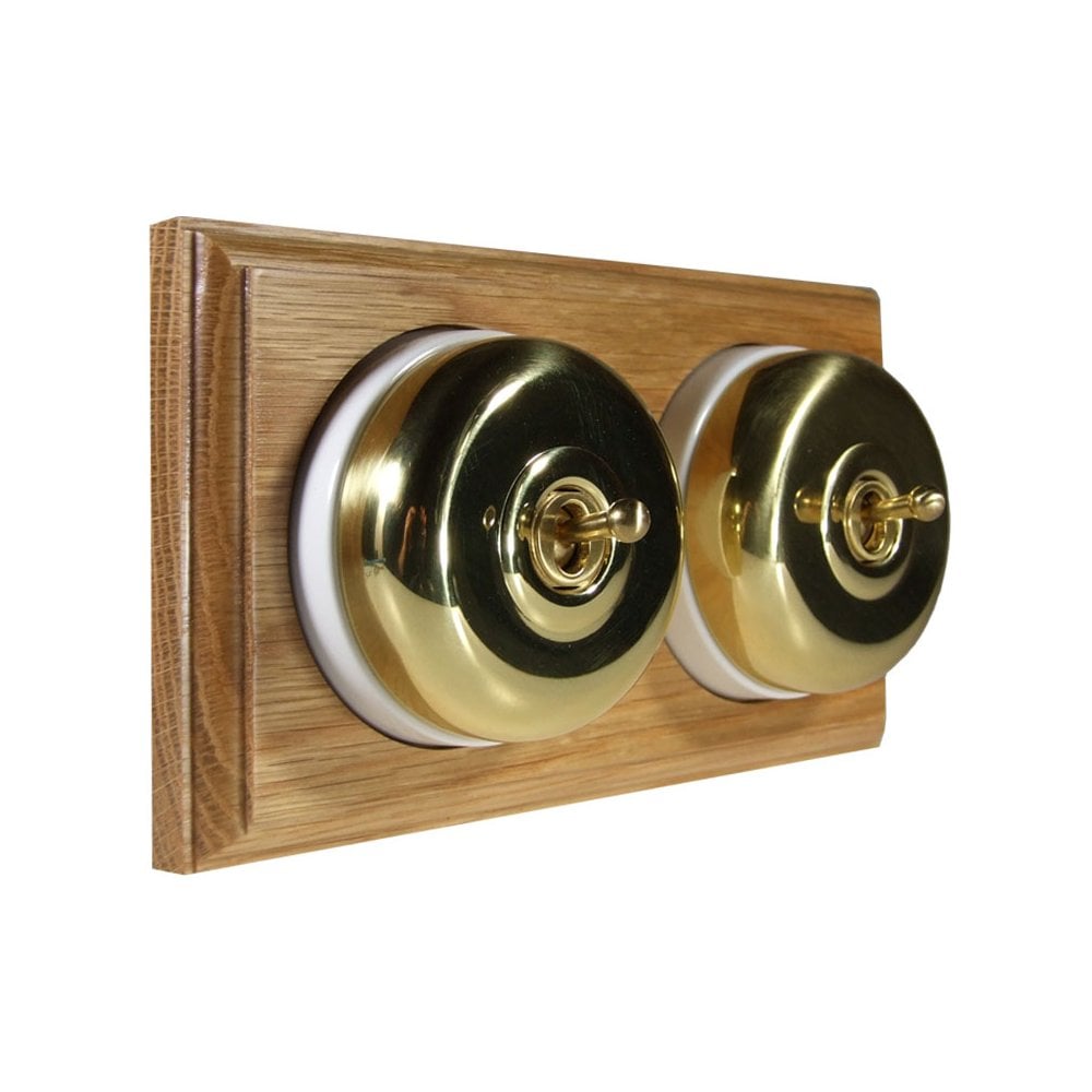 Switch to Wood's Dolly Light Switch Smooth Dome - 2 Gang Horizontal Polished Brass in Light Oak