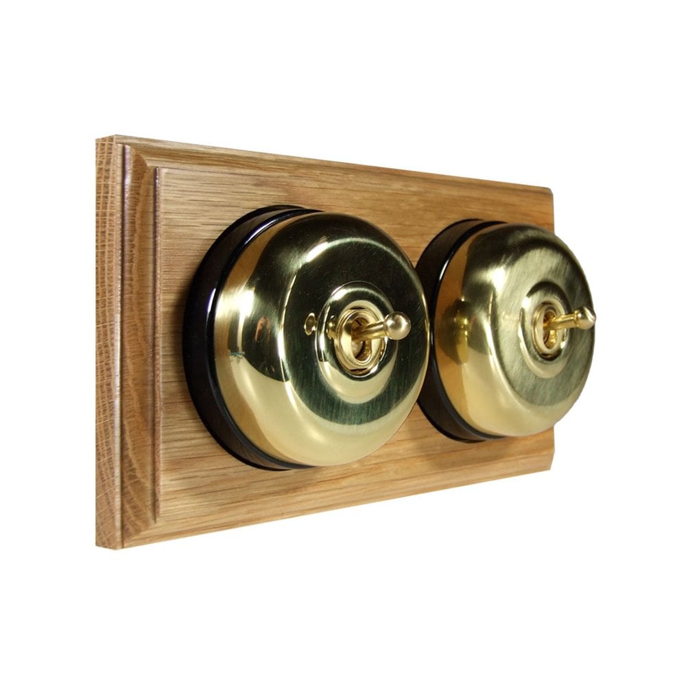 Switch to Wood's Dolly Light Switch Smooth Dome - 2 Gang Horizontal Polished Brass in Light Oak