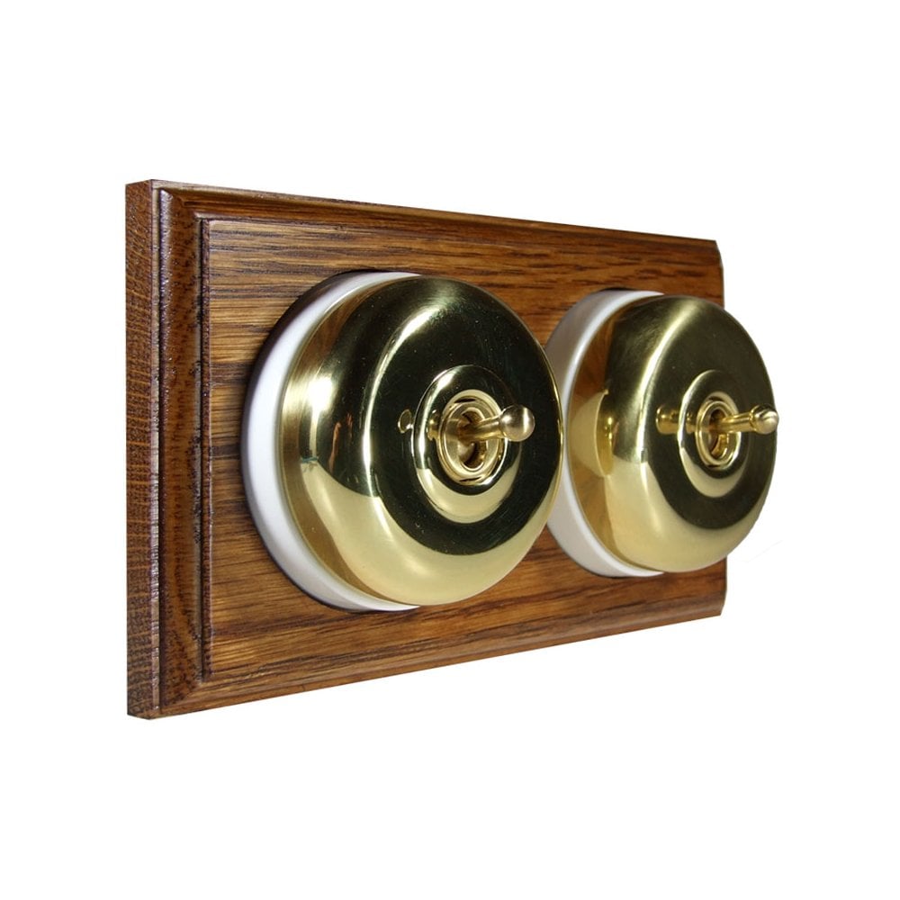 Switch to Wood's Dolly Light Switch Smooth Dome - 2 Gang Horizontal Polished Brass in Medium Oak 