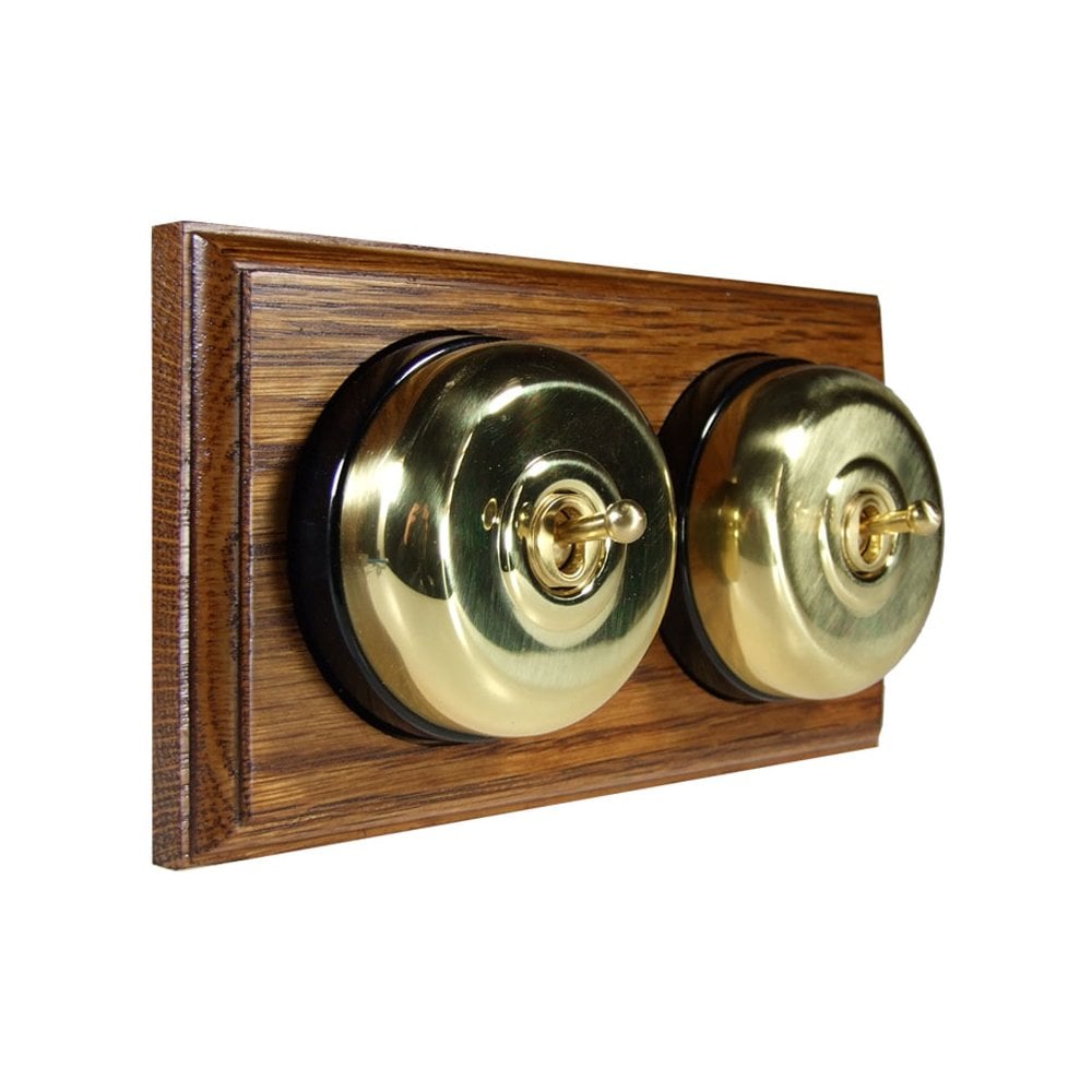 Switch to Wood's Dolly Light Switch Smooth Dome - 2 Gang Horizontal Polished Brass in Medium Oak 