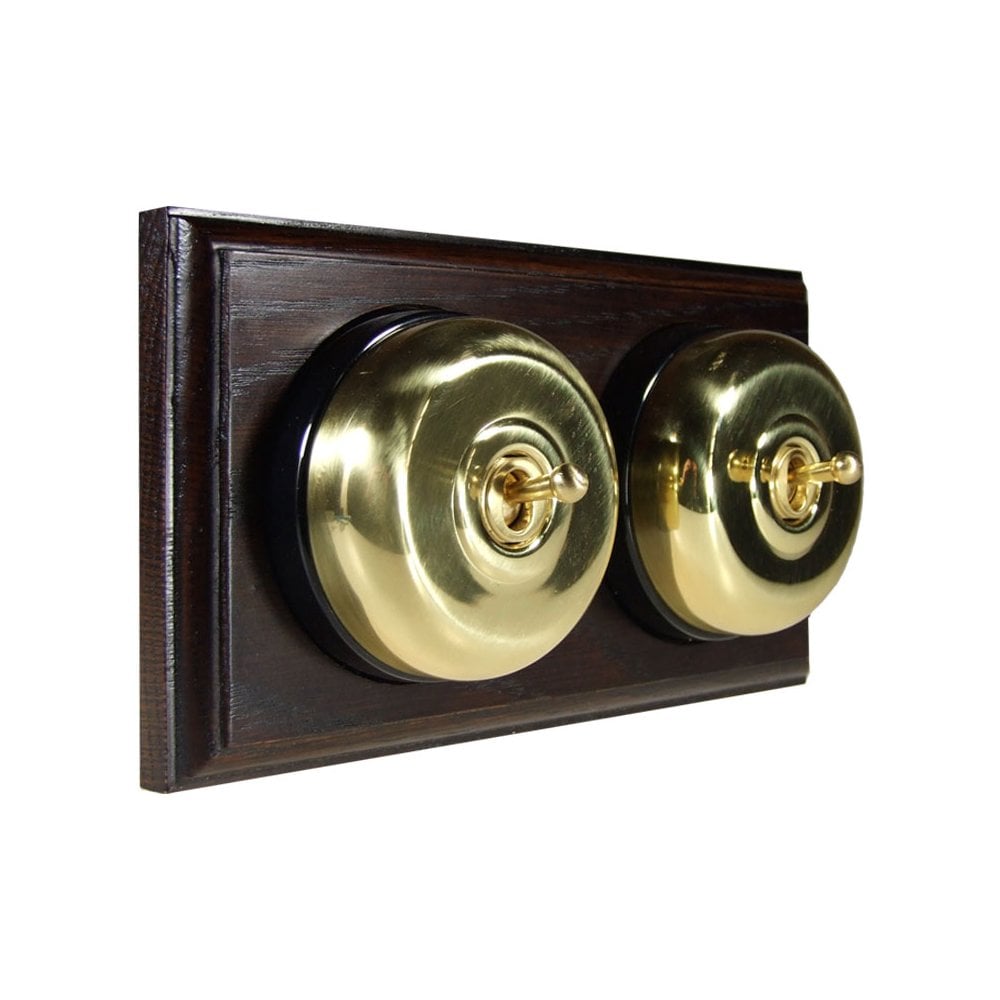 Switch to Wood's Dolly Light Switch Smooth Dome - 2 Gang Horizontal Polished Brass in Dark Oak