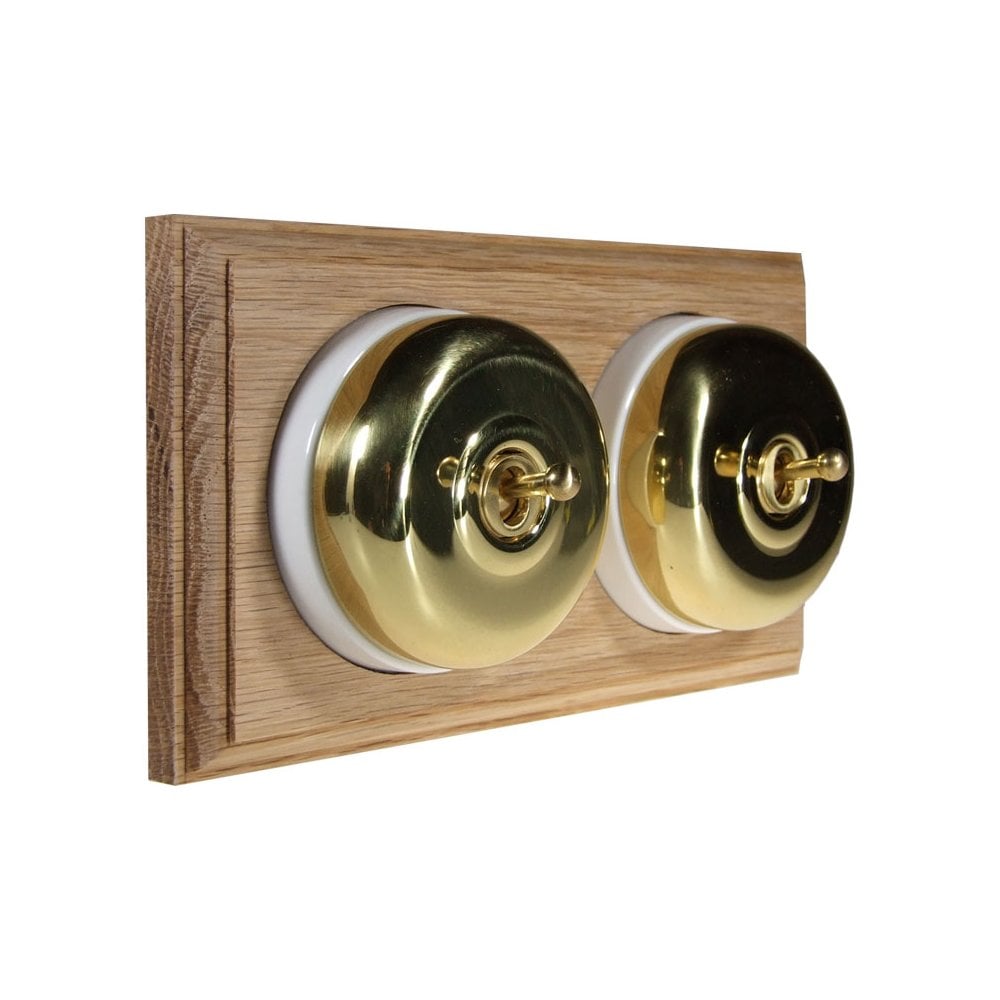 Switch to Wood's Dolly Light Switch Smooth Dome - 2 Gang Horizontal Polished Brass in Unfinished Oak