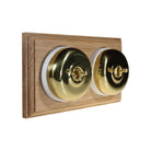 Switch to Wood's Dolly Light Switch Smooth Dome - 2 Gang Horizontal Polished Brass in Unfinished Oak