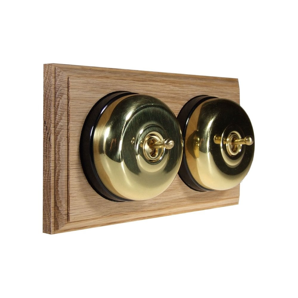 Switch to Wood's Dolly Light Switch Smooth Dome - 2 Gang Horizontal Polished Brass in Unfinished Oak