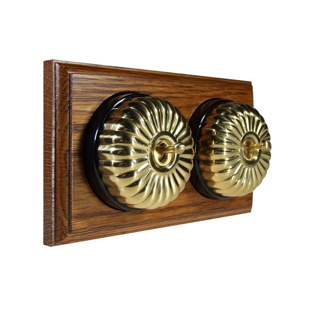 Switch to Wood's Dolly Light Switch Fluted Dome - 2 Gang Horizontal Polished Brass in Medium Oak 