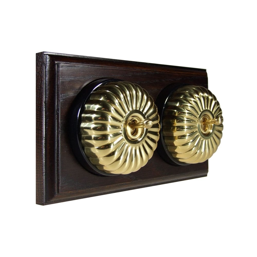 Switch to Wood's Dolly Light Switch Fluted Dome - 2 Gang Horizontal Polished Brass in Dark Oak