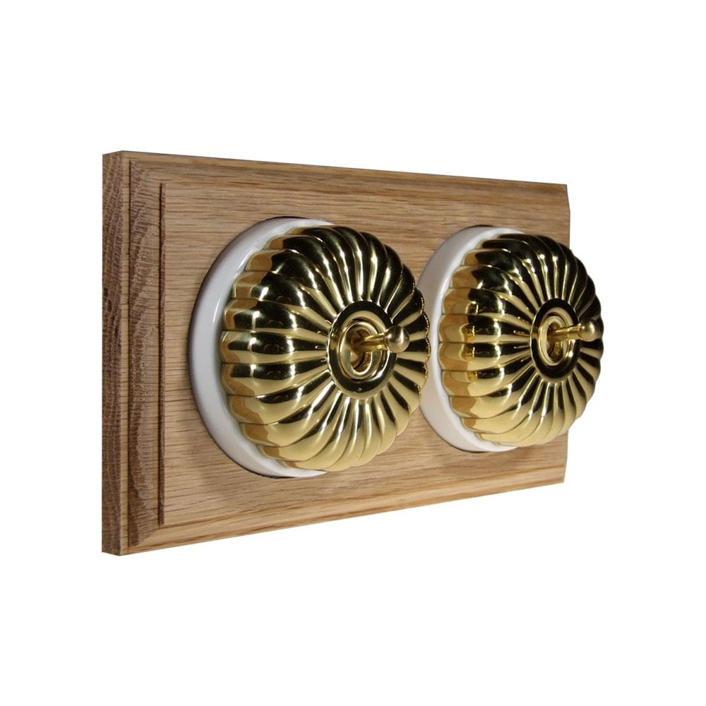 Switch to Wood's Dolly Light Switch Fluted Dome - 2 Gang Horizontal Polished Brass in Unfinished Oak