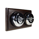 Switch to Wood's Dolly Light Switch Smooth Dome - 2 Gang Horizontal Polished Chrome in Dark Oak