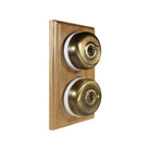 Switch to Wood's Dolly Light Switch Smooth Dome - 2 Gang Vertical Antique Brass in Light Oak