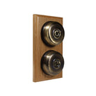 Switch to Wood's Dolly Light Switch Smooth Dome - 2 Gang Vertical Antique Brass in Light Oak