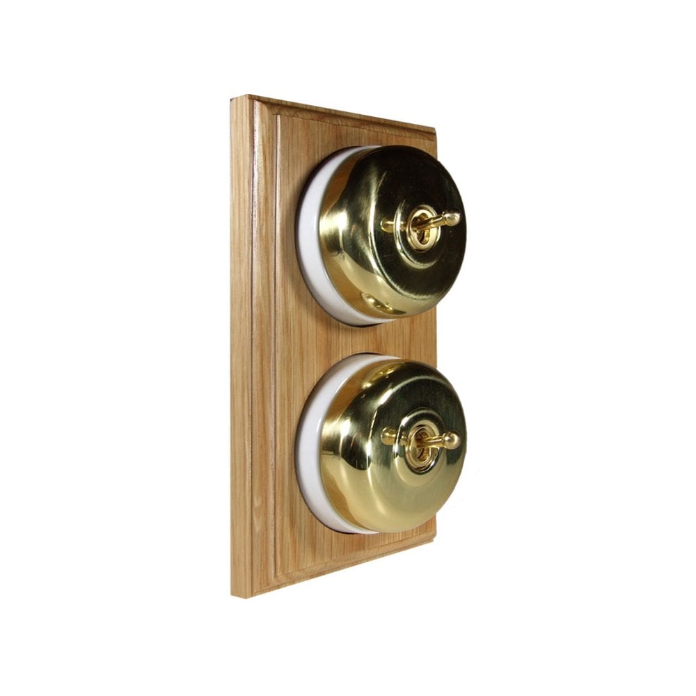 Switch to Wood's Dolly Light Switch Smooth Dome - 2 Gang Vertical Polished Brass in Light Oak
