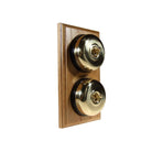 Switch to Wood's Dolly Light Switch Smooth Dome - 2 Gang Vertical Polished Brass in Light Oak